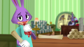 Flue Lou holding in a sneeze with a handkerchief and a ToonTask scroll.